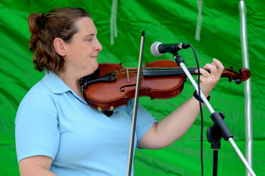 Emily Miller performing at New Street Corner on Honiton Market Charter Day 2025
