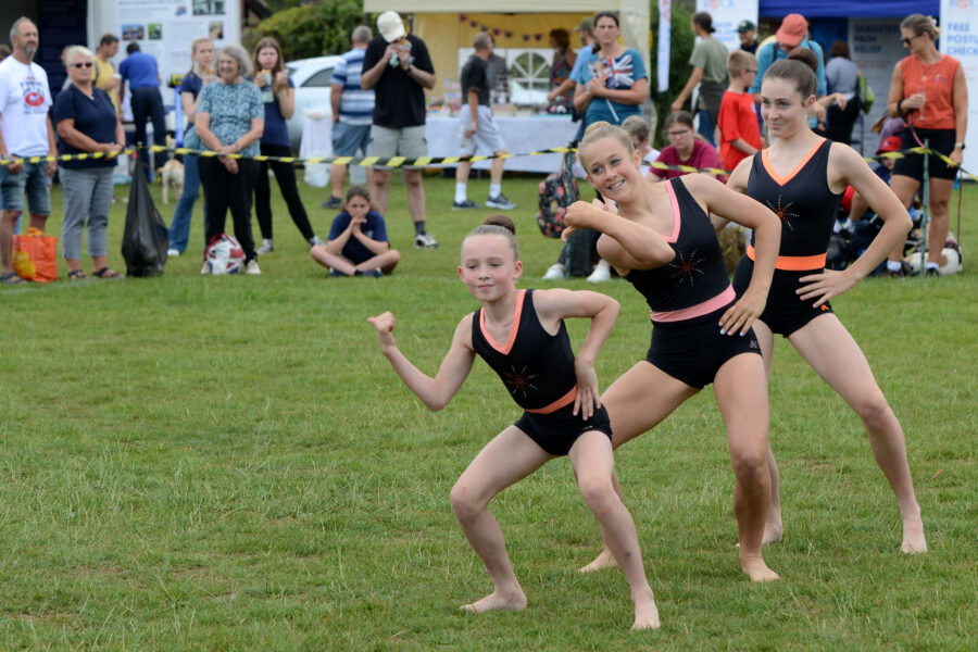 Honiton Gymnastics Club performing in the arena on Allhallows Field on Honiton Market Charter Day 2025