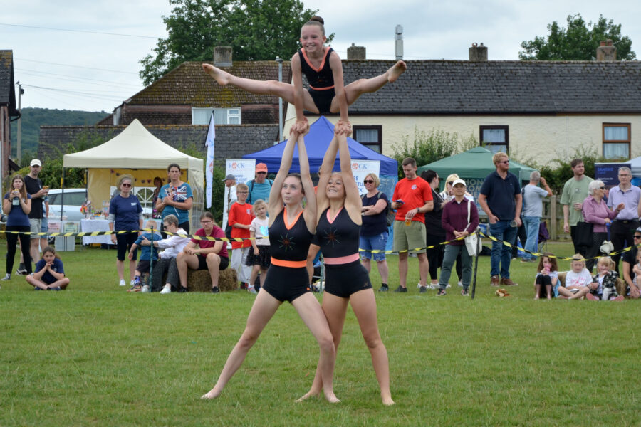 Honiton Gymnastics Club performing in the arena on Allhallows Field on Honiton Market Charter Day 2025