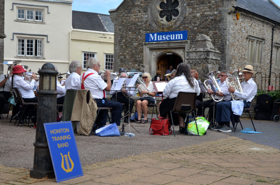 Honiton Training Band performing outside St Paul's Church on Honiton Market Charter Day 2025