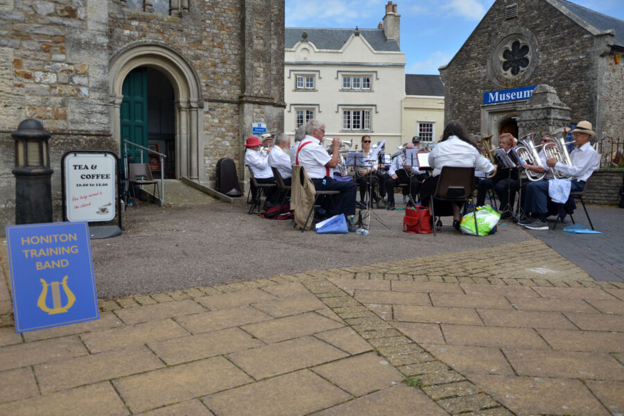 Honiton Training Band performing outside St Paul's Church on Honiton Market Charter Day 2025