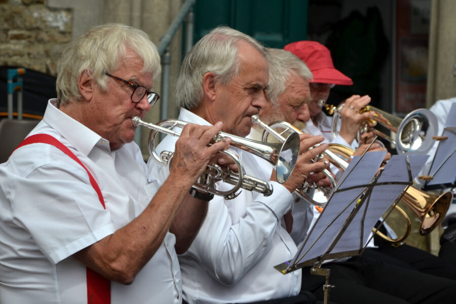 Honiton Training Band performing outside St Paul's Church on Honiton Market Charter Day 2025