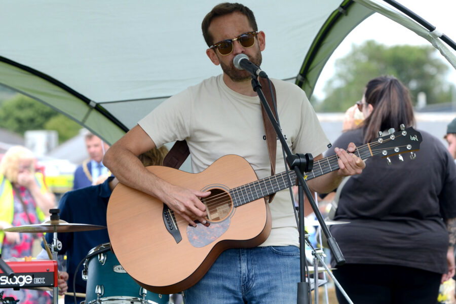 Red Stitches playing on Allhallows Playing Field at Honiton Market Charter Day 2025
