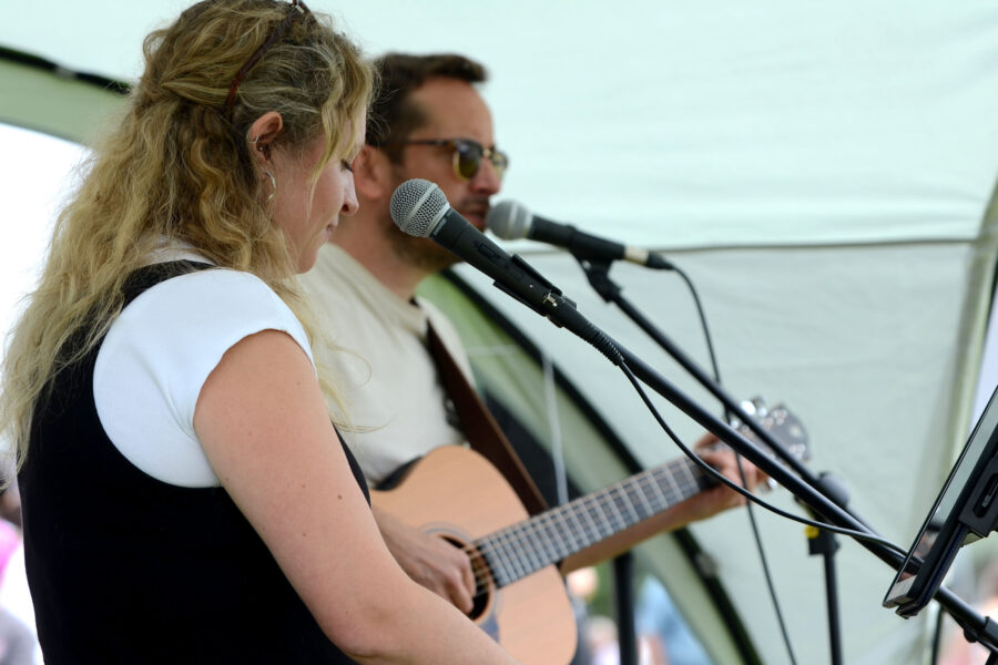 Red Stitches playing on Allhallows Playing Field at Honiton Market Charter Day 2025