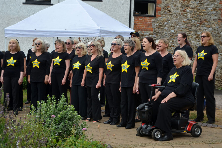 The Rock Choir performing at Honiton Market Charter Day 2025
