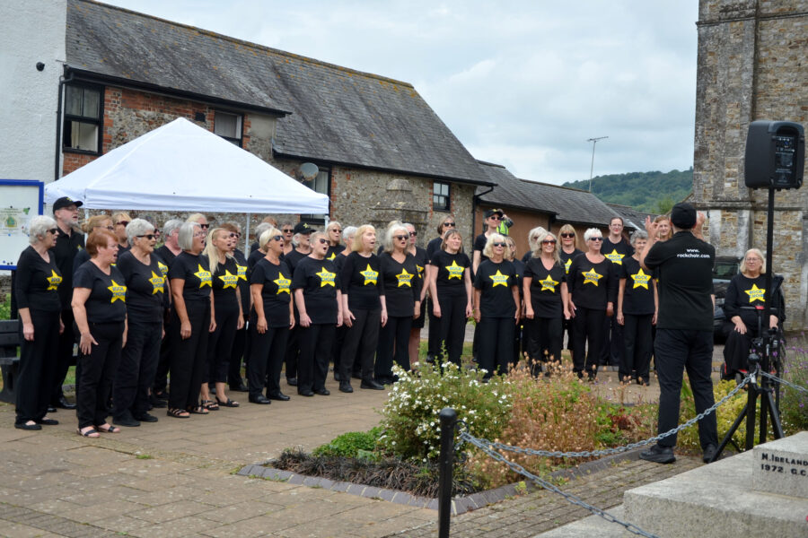 The Rock Choir performing at Honiton Market Charter Day 2025
