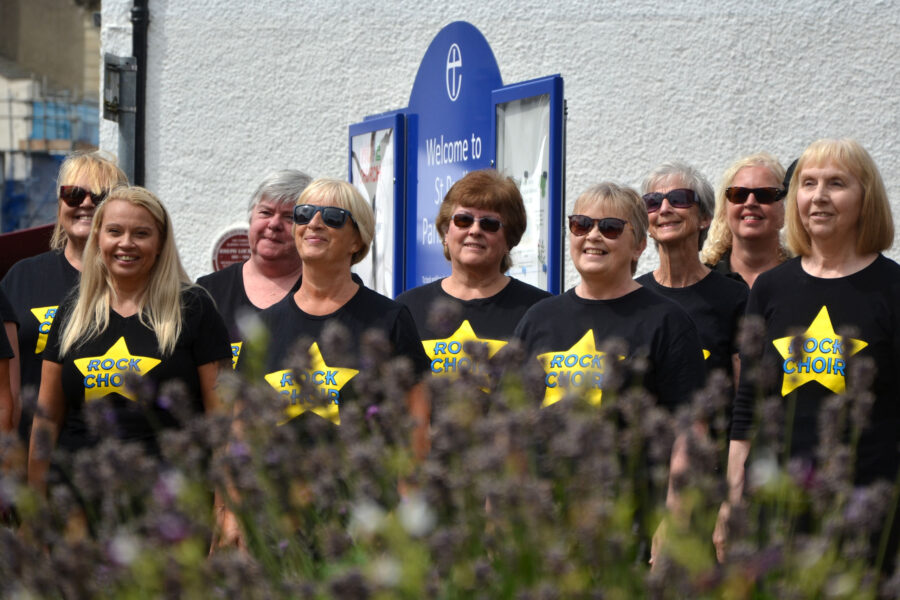 The Rock Choir performing at Honiton Market Charter Day 2025