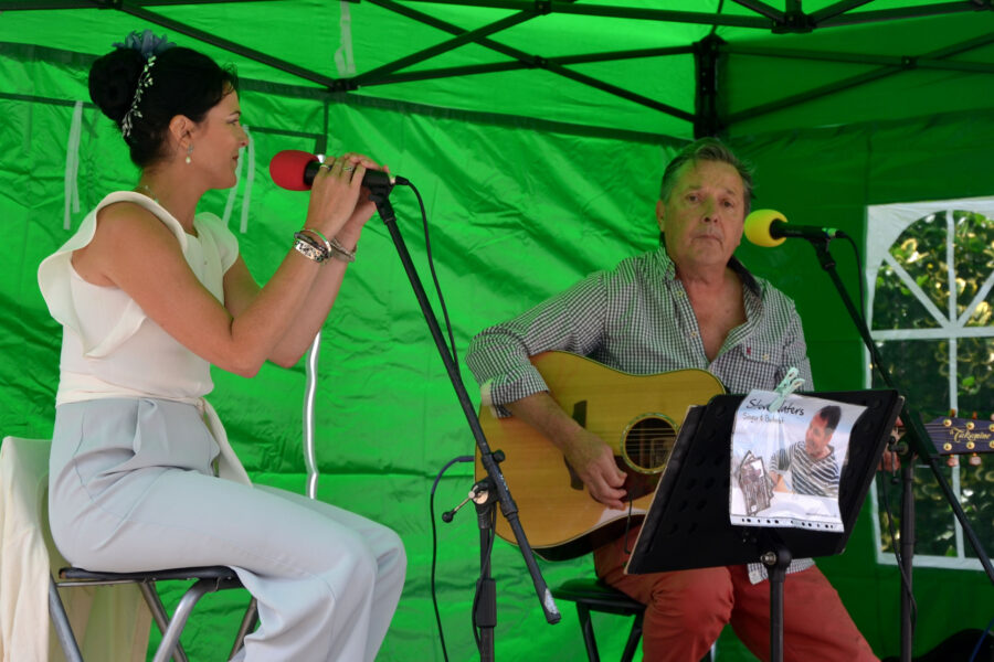 Steve Waters and Alex Oakes performing on New Street Corner at Honiton Market Charter Day 2025