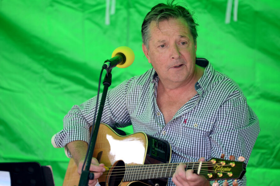 Steve Waters performing on New Street Corner at Honiton Market Charter Day 2025