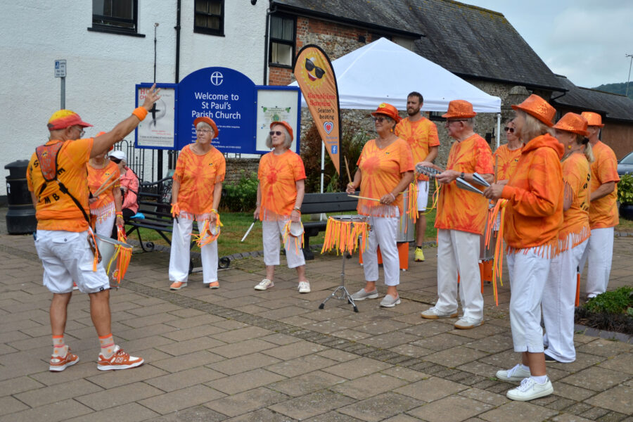 Sunshine Samba performing outside St Paul's Church on Honiton Market Charter Day 2025