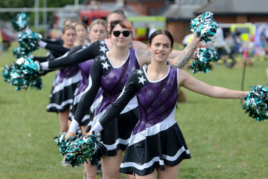 Twirlstars Majorettes performing on Allhallows Field at Honiton Market Charter Day 2025