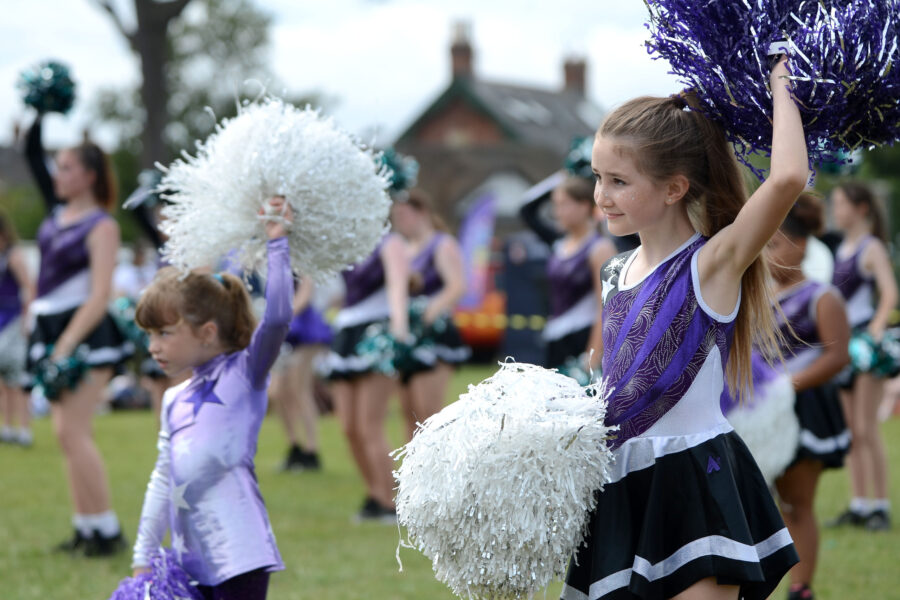 Twirlstars Majorettes performing on Allhallows Field at Honiton Market Charter Day 2025