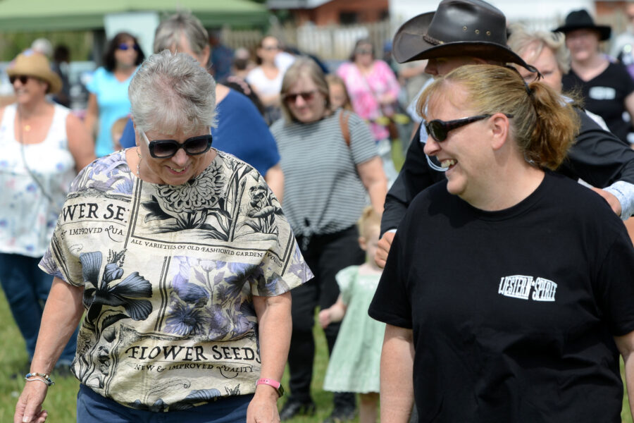 Western Spirit Line Dance Club performing on Allhallows Field at Honiton Market Charter Day 2025.