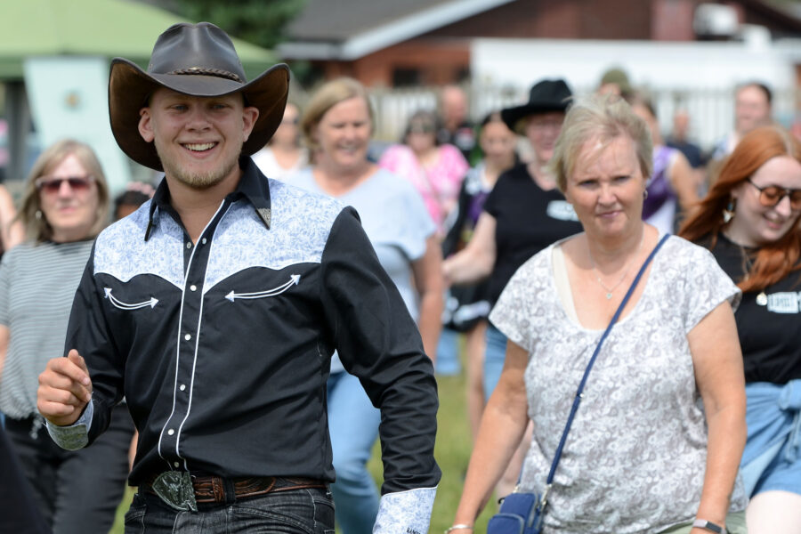 Western Spirit Line Dance Club performing on Allhallows Field at Honiton Market Charter Day 2025.